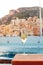 Vertical closeup shot of a glass of champagne on the board of a yacht