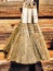 Vertical closeup shot of a group of small natural brooms on a wooden background