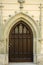 Vertical closeup shot of an intricate wooden door of an old building