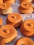 Vertical closeup shot of many earthen clay cooking pots on a table