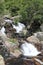 Vertical closeup shot of Nature Devil`s cataract, Extremadura Spain