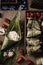 Vertical closeup shot of preparation of rice dumplings with banana leaves