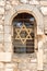 Vertical closeup shot of the Star of David in a window in Jerusalem, Israel