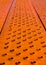 Vertical closeup shot of a textured bumpy orange surface