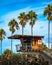 Vertical closeup shot of a tiny wooden lifeguard tower on the La Jolla coast on a sunny day