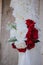 Vertical closeup shot of a white red rose bridal bouquet