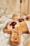 Vertical closeup of a wooden board with Marmelade buns on it