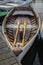 Vertical closeup of a wooden rowboat in harbor in New England