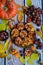 Vertical composition. Appetizing apple muffins, pumpkins and leaves on an autumn wooden background.