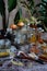 Vertical composition. Multi-colored spices in jars on a wooden background