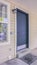 Vertical Covered patio to a white timber house