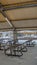 Vertical Covered picnic area and playground at a park blanketed with snow in winter