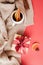 Vertical cozy holiday card, vitamin tea with orange, cinnamon sticks and anise in porcelain Cup, gift with red satin ribbon, beige