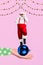 Vertical creative collage picture of big arm palm hold bauble ball toy mini excited santa dancing have fun isolated on