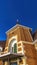 Vertical crop Exterior of a church in Provo Utah with brick wall under vivid clear blue sky