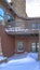 Vertical crop Home with balcony over snowy entrance built on Wasatch Mountain neighborhood