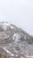 Vertical crop Provo Canyon mountain with steep rugged slopes dusted with snow in winter