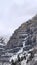 Vertical crop Stunning Bridal Veil Falls in Provo Canyon with frozen water on the rugged slope