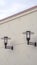 Vertical crop Two exterior electric lights with shades day light