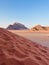 Vertical Desert Landscape with Red Sands and Rocky Horizon