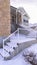 Vertical Double flight of stairs covered in fresh snow