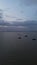 Vertical drone footage of over the water of the lake. Aerial view of lake.
