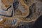 Vertical drone panorama of open mine or quarry on a sunny day at Verd, Slovenia. Visible terraces and vast surface of sand and