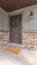 Vertical Entrance door to a house with feature stone wall