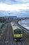 Vertical evening aerial-like north-oriented view of Irish railway along coastline