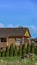 Vertical Exterior of house under construction with blue sky background on a sunny day