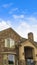 Vertical Exterior of a splendid house with a combination of stone and conrete wall.