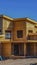 Vertical Exterior view of a house under construction under blue sky on a sunny day