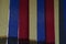 Vertical fabric blinds of blue, yellow and red colors