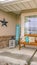 Vertical Facade of a home with a wooden bench on the welcoming front porch