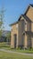 Vertical Facade of homes with concrete and brick wall and porticos at the front door