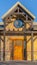 Vertical Facade of a rustic building against vivid blue sky on a sunny day