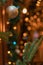 Vertical festive photography of decorated Christmas space with ball toy and bokeh background lights gold colored