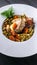 Vertical food banner Baked meat with vegetables. Potatoes, carrots, green peas and turkey meat on a white plate