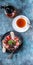 Vertical food banner. Curd dessert. Fruit tea, fresh strawberries, mint leaves and sugar cookies