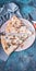 Vertical food banner. Pizza with mushrooms and cheese on a round board. Fork, knife and napkin. Pizza time concept