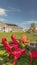 Vertical frame Backyard chairs around a stone fire pit adjacent to a picnic table with bench