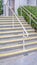 Vertical frame Cement entrance steps with yellow warning on a sunny day