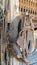 Vertical frame Close up of old and dirty horse saddle with rusty metal and damaged leather