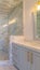Vertical frame Interior of stone tiled contemporary bathroom teal tile