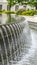 Vertical frame Stone fountain with trickling water and pool at the Utah State Capital Builidng