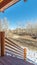 Vertical frame Wooden porch overlooking winter countryside day light