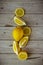 Vertical fresh sliced lemon on wooden natural background