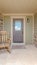 Vertical Front porch of modern house with rocking chair