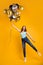 Vertical full length photo of lady having best time with air balloons in hands wear casual outfit isolated yellow