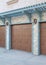 Vertical Garage exterior with wall-mounted light blue pergola and doorframe